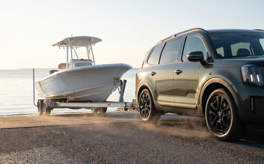 Kia Telluride X-Pro towing a boat — 5,500 lb max towing